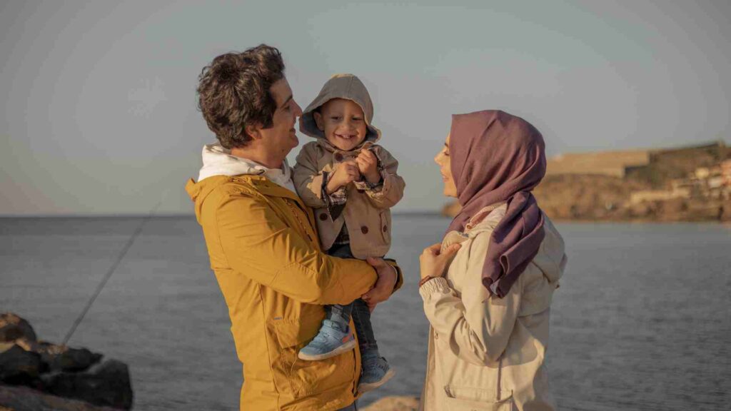 Turkish family laughing with their baby