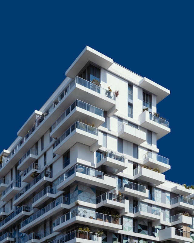 White stacked apartments in blue sky