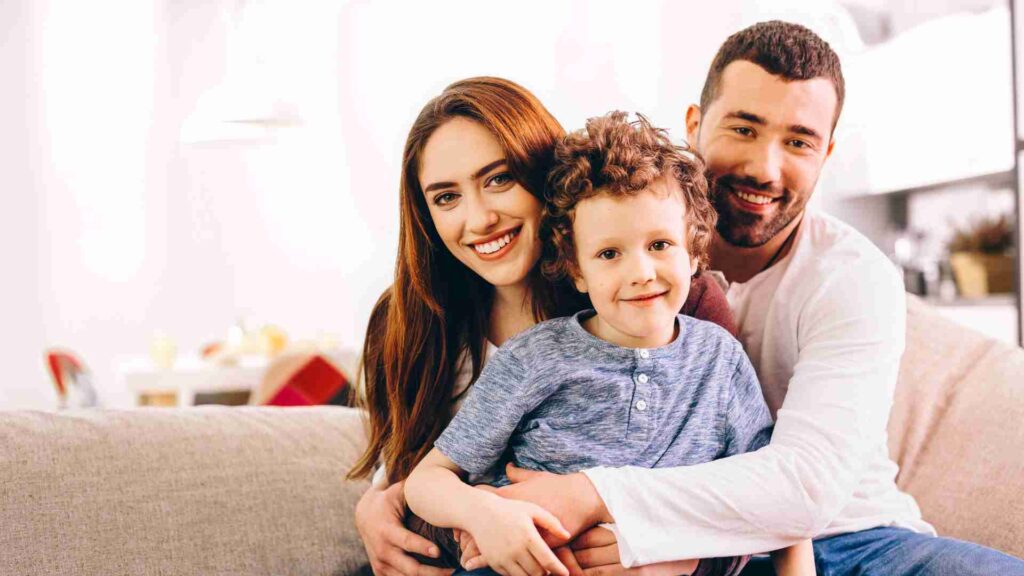 A Portuguese family hugging and smiling together