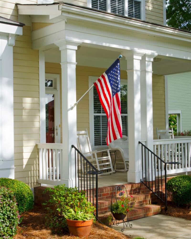 A house with a garden with a US flag