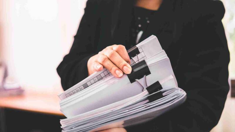 A man checking his E-2 visa requirements documents